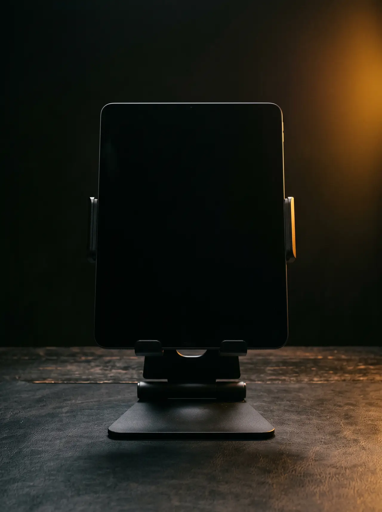 A tablet upright on a desk stand, screen blank